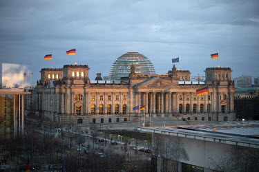 Exterior view of the Reichtag, the German parliament (Deutscher Bundestag) by architect Sir Norman Foster with a view towards Berlin Mitte, seen from inside the Chancellery Office.