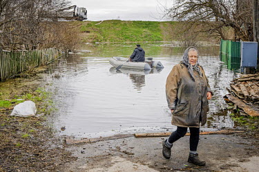 A man uses a boat to access Demydiv where over 50 houses were flooded after the destruction of the River Irpin dam on 28 February 2022 led to 13,000 hectares of former floodplain and wetland being inu...