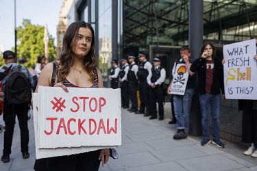 A woman holds a placard that reads 'Stop Jackdaw' at a protest in Westminster outside the Department for Business, Energy and Industrial Strategy (BEIS) against the licensing of Shell's new Jackdaw oi...
