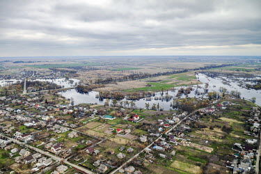 A view of the flooded village of Demydiv. This area was largely swamp and marshland until the dams were built from the 1950s onwards. The cause of the current flooding is not clear with speculation th...