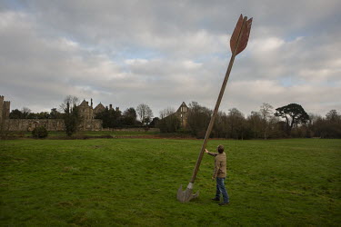 A man looks at a giant arrow near Battle Abbey, built on the site of the Battle of Hastings (14 October 1066).