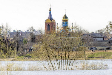 The waters from the flooded Irpin river in the vicinty of the Church of St. Archangel Michael of Ukrainian Orthodox church.