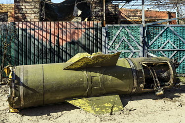 The remains of an OTR-21 Tochka missile lies on a street near the Irpin dam which was destroyed on 28 February 2022.