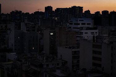 Nightfall in Beirut, where residents are lucky to receive two hours of electricity per day from the national grid and must use private generators and bottled gas for the rest of their needs.  Followin...