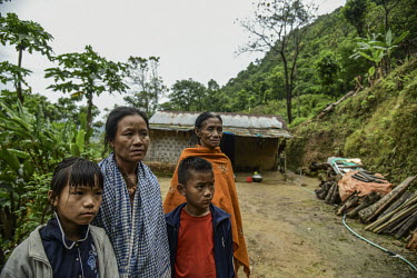 A family mourn Pauramsuilungbe Jeme at their house in Hokai Puonchi village. L-R: Gongtingyile (daughter), Lrialungle (wife), Kijuihungbe (son), Nkuilungle (mother).