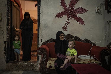Najwa Hashem Ibrahim, grandmother of Fouad (L, 13  months) and Mahdi (R, two years). Mahdi has a rare blood disease which has meant the family have had to sell much of what they own to pay for his med...