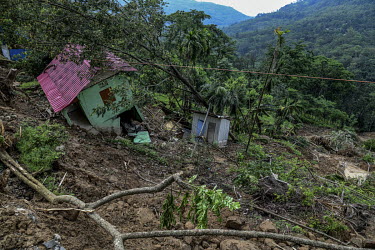 A house destroyed by a landslide in the Dima Hasao district.