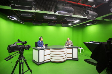 A live broadcast being transmitted from a green screen studio at Istiklal TV, the bigest television station among the Uyghur diaspora which broadcasts on the internet.