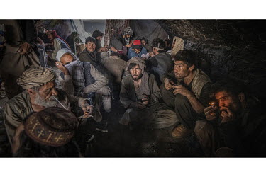 Drug addicted people smoking heroin beneath the Pul-e-Sukhta bridge (Pul-i-Sokhta) where, one estimate claimed, up to 1000 drug users regularly gather.