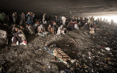 Drug addicted people squat among the detritus beneath the Pul-e-Sukhta bridge (Pul-i-Sokhta) where, one estimate claimed, up to 1000 drug users regularly gather.