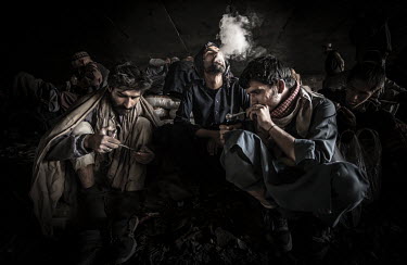 Drug addicted people smoking heroin and methamphetamine beneath the Pul-e-Sukhta bridge (Pul-i-Sokhta) where, one estimate claimed, up to 1000 drug users regularly gather.