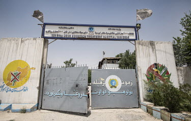 Taliban flags fly above the security gate at the entrance to the Ibn Sina drug addiction hospital.