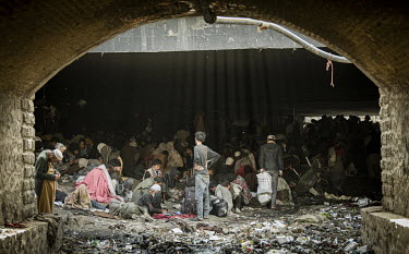 Drug addicted people squat among the detritus beneath the Pul-e-Sukhta bridge (Pul-i-Sokhta) where, one estimate claimed, up to 1000 drug users regularly gather.