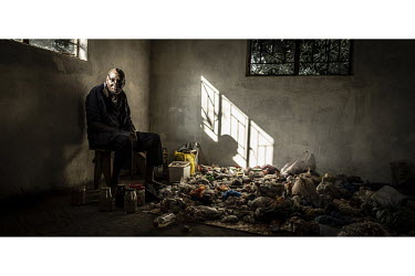 Dr Mubita sits beside a store of traditional medicines at his home. The 'Witch Doctor' and traditional healer is often consulted on medical matters including schistosomiasis (bilharzia).Female Genital...