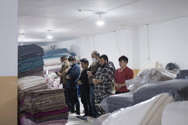 Uygur staff in a textile company in Zeytinburnu stop work in order to pray.