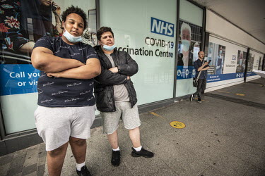 Kyron Korbel (18, left) and Sam Harris (18), at the COVID-19 vaccination centre at the Liberty Shopping Centre in Romford. They have been friends since primary school and have come together for the ja...