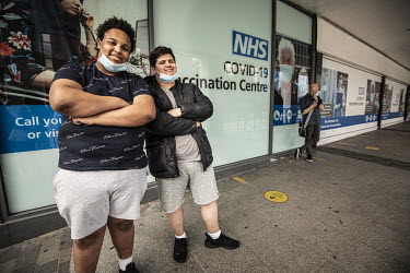 Kyron Korbel (18, left) and Sam Harris (18), at the COVID-19 vaccination centre at the Liberty Shopping Centre in Romford. They have been friends since primary school and have come together for the ja...