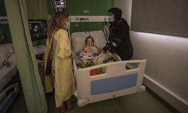 Rania Bassil, a paediatric cardiologist, treats Farah Ahmediyeh (3), who has cerebral palsy and has had COVID-19 and now pneumonia, is treated in the paediatric intensive care unit at the Karantina Ho...