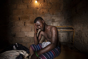 Nathaniel Tavares (31), suffering from withdrawal symptoms as he waits for crack in a crack den in the neighbourhood of Ponta De Agua, Praia.  The Cape Verde islands lie on what's known as 'Highway 10...