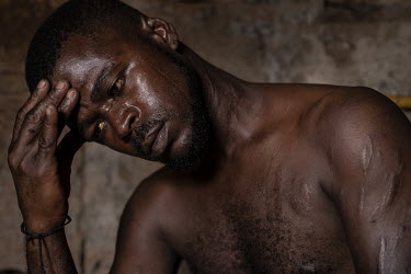 Nathaniel Tavares (31), suffering from withdrawal symptoms as he waits for crack in a crack den in the neighbourhood of Ponta De Agua, Praia.  The Cape Verde islands lie on what's known as 'Highway 10...