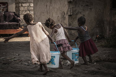 Girls carry drinking water from a well in Kanyama compound, which has a population of 400,000.Female Genital Schistosomiasis (FGS) is a waterborne parasitic disease affecting women. Symptoms include l...