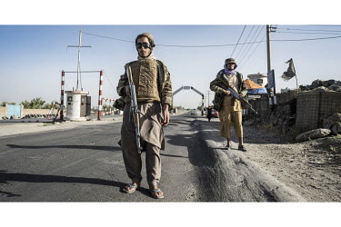Taliban guards at a checkpoint on a road outside Kabul.
