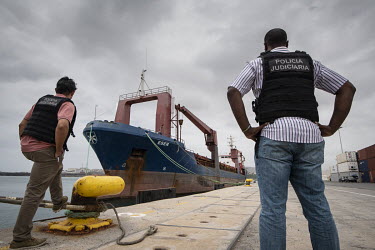 Police officers involved in the raid on the freighter Eser look at the docked ship. In February 2019, police on the island made the world's biggest-ever seizure of Europe-bound cocaine, when they foun...