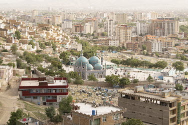 A mosque with blue domes in a residential area of the city.