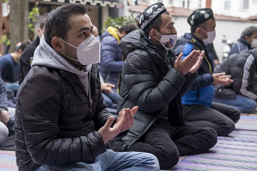 Alimcan Turdi, an ethnic Uyghur (2nd from left), praying with other Uyghurs during a demonstration in front of the Chinese embassy in Istanbul protesting human rights abuses against Uyghurs in Xinjian...