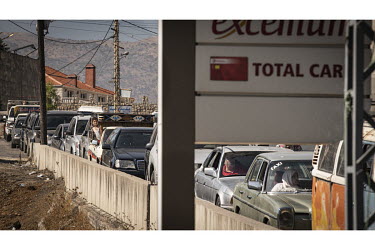 A long queue for fuel in the Bekaa Valley.   Following political collapse and the pandemic, the Lebanese economy plunged, wiping out 90% of people's savings and resulting in massive inflation. The amm...
