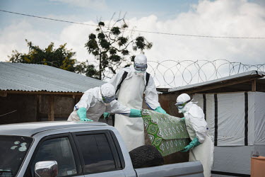 Staff prepare bury Elodie Kitsama (19) who died from ebola the previous day at the Beni Ebola Treatment Centre. Elodie, who was still at school, died after four days of treatment at the centre. The po...