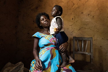 Ebola survivor Rachel Kavuro and her daughter Noella Kavira Meso. Kavuro lost four members of her family to Ebola (her husband, her 2-1/2 year old daughter, her mother-in-law and her sister-in-law) af...