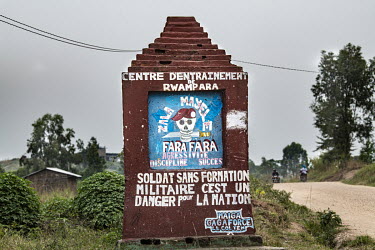 A sign announcing the army unit controlling the roads near Bunia where the roads are particularly unsafe.  There are at least 5.5 million internally displaced people (IDPs) in the DRC, mostly in the e...