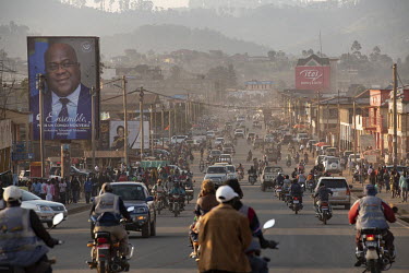 A billboard poster of President Felix-Antoine Tshisekedi Tshilombo at the side of a busy road in the centre of Butembo where high density living makes the spread of the ebola virus difficult to stop.