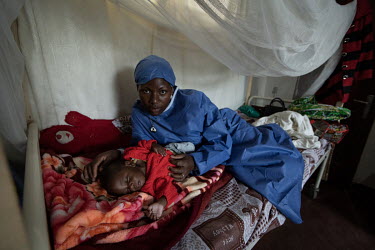 Ebola survivor Esperance looking after five-month old baby boy, Bosco (not real name). Masinda's husband was among the very first victims of the Ebola outbreak in July 2018 and she became ill in Augus...