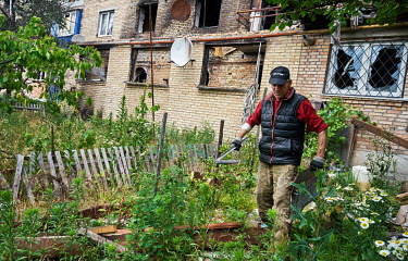 Valeriy clearing debris around the apartment blocks in Horenka. Horenka is a small village on the outskirts of Kyiv, which was shelled by Russian forces during the attack on Kyiv.