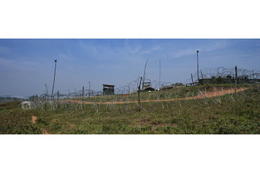 Barbed wire surrounds the MONUSCO (United Nations Organization Stabilization Mission in the Democratic Republic of the Congo) compound above an IDP camp.  There are at least 5.5 million internally dis...