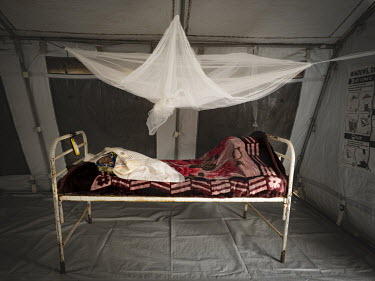 Rosina (4 months) sleeps in the UNICEF creche at the Ebola Treatment Centre in Butembo. Her mother is in seriously unwell with Ebola although Rosina has not tested positive for the disease.   An Ebola...