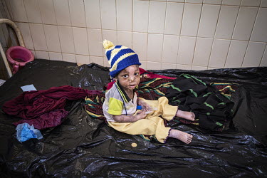A child being treated in the Kaya Regional Hospital which is operating at over 100% capacity, in many cases there are three patients per bed.   Once considered 'safe', Burkina Faso (meaning 'land of t...