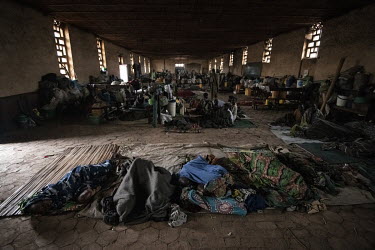 Sleeping people surrounded by possessions in a disused church along with several hundred other IDPs in Drodro where at least 20,000 displaced people are living.  There are at least 5.5 million interna...