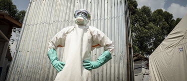 Hygienist Bertrand Karumba (33) wearing his personal protective equipment as he prepares to enter the Ebola treatment centre's treatment area.  An Ebola outbreak was declared on 7 February 2021 in But...
