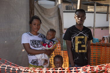 Fazeela Mayamoto, with her seven month old son, Desire and a four year old boy Felix (not real names). The family caught Ebola after handling the corpse of Fazeela's grandfather. Her oldest son died,...