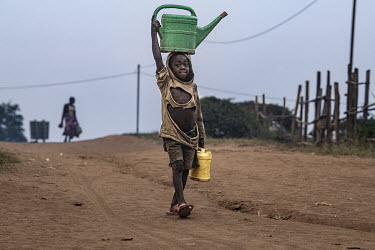 An IDP boy carries containers of water in Drodro where at least 20,000 displaced people are living.  There are at least 5.5 million internally displaced people (IDPs) in the DRC, mostly in the eastern...