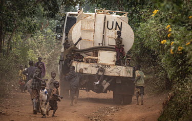Children play on a MONUSCO (United Nations Organization Stabilization Mission in the Democratic Republic of the Congo) water truck.  There are at least 5.5 million internally displaced people (IDPs) i...