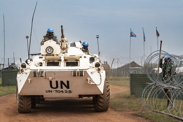 MONUSCO (United Nations Organization Stabilization Mission in the Democratic Republic of the Congo) peacekeepers from Bangladesh leave their camp to patrol in an armoured vehicle.  There are at least...