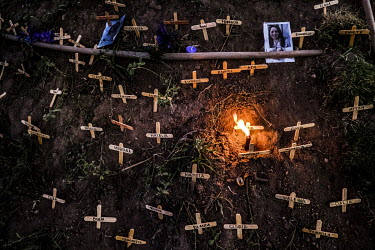 A protest display of small wooden crosses with names of women murdered in 2018, part of an artistic performance organised by Amorales, a feminist theatre group.  El Salvador is considered by multiple...