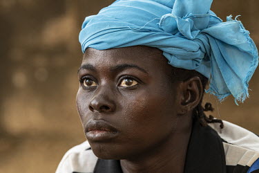 A woman at Oasis des Enfants Orphanage, founded 1969.  Once considered 'safe', Burkina Faso (meaning 'land of the upright man') is suffering from increasing instability as a result of attacks from jih...