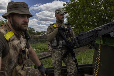 Ukrainian soldiers at a checkpoint armed with a recently donated American heavy calibre machine gun near the village of Vilne Pole.