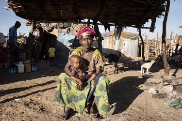 Djenneba Fall (27) and one of her children, who are from a village in the Bankass Circle but are now in an IDP camp in Bamako.  Thousands of Fulani (semi-nomadic herders of the Sahel) have been displa...
