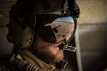 Sgt Alex operates the door guns in a Chinook during an RAF flight over the desert, part of Operation NEWCOMBE CH47, the codename for British military assistance to France's Operation Barkhane. NEWCOMB...